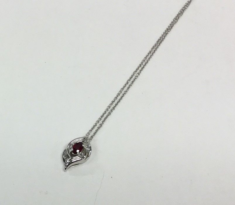 A stylish 18 carat gold ruby and diamond pendant w
