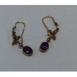 A pair of amethyst and pearl drop earrings in gold