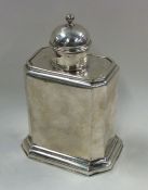 A George I silver caddy with cut corners and slidi