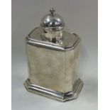 A George I silver caddy with cut corners and slidi