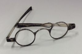 A pair of Georgian silver spectacles with hinged m