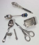 A bag containing silver spoons, scissors etc. Appr