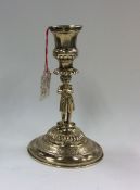 A small circular Continental silver gilt candlesti