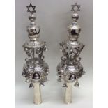A pair of massive silver Torah bells with embossed