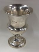 BARNARDS: A tapering silver campana shaped goblet.