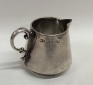 A stylish silver tapering cream jug. London. By JB