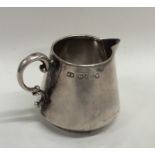 A stylish silver tapering cream jug. London. By JB