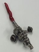 A good Georgian silver miniature rattle inset with