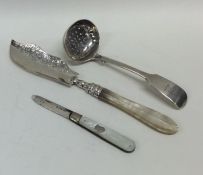 An Edwardian silver sifter spoon together with a b