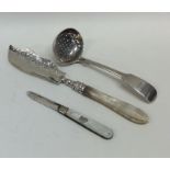 An Edwardian silver sifter spoon together with a b