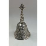 A Dutch silver model of a bell attractively chased