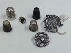 A bag containing silver thimbles, brooches etc. Ap