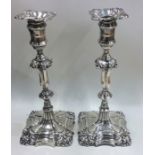 A good tall pair of Georgian style silver candlesticks wi