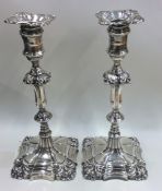 A good tall pair of Georgian style silver candlesticks wi