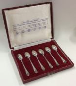 A cased set of six rat tail silver teaspoons. Appr