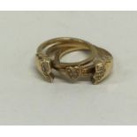 An unusual gold and diamond split ring with hinged