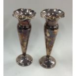 A pair of silver spill vases with crimped rims. Bi