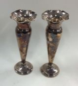 A pair of silver spill vases with crimped rims. Bi