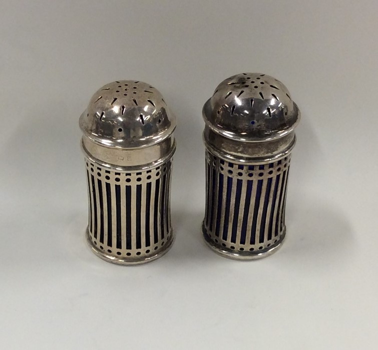 A pair of Edwardian silver pierced peppers with li - Image 2 of 3