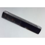 LIBERTY & CO: A stylish silver comb of typical for