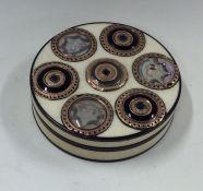 An Antique circular ivory and gold mounted box wit