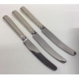 A set of three Georgian silver knives with engrave