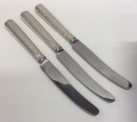 A set of three Georgian silver knives with engrave