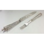 A pair of Victorian silver engraved fish servers.