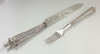 A pair of Victorian silver engraved fish servers.