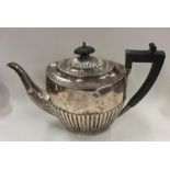 An Edwardian half fluted silver teapot. Sheffield.
