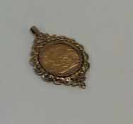 A 1908 sovereign mounted as a pendant. Approx. 13.