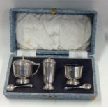 A good boxed three piece silver cruet set. Birming