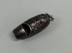 A Continental silver whistle decorated with figure