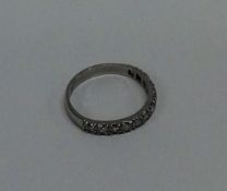 An attractive diamond half eternity ring in platin