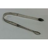 A pair of Georgian silver sugar tongs. London. By