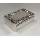 A massive silver snuff box with chased decoration
