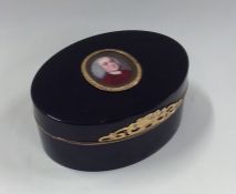 A tortoiseshell and gold mounted oval snuff box wi