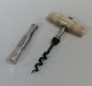 A good Georgian silver travelling corkscrew with t