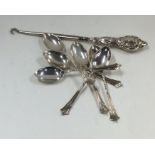 A set of six silver coffee spoons with twisted ter