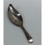 A good Georgian silver bright cut caddy spoon with