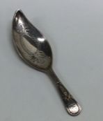 A good Georgian silver bright cut caddy spoon with