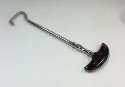 An unusual tortoiseshell mounted shoe lift. Est. £