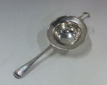 A circular Scottish silver tea strainer. Edinburgh