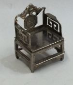 A Continental child's miniature silver chair of Or