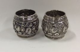 A pair of Indian silver napkin rings decorated wit