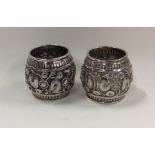 A pair of Indian silver napkin rings decorated wit
