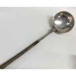 A Scottish silver toddy ladle with whale bone hand