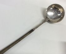 A Scottish silver toddy ladle with whale bone hand