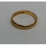 A wide 22 carat gold plain wedding band. Approx. 5