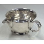 An unusual George II silver invalid cup on spreadi